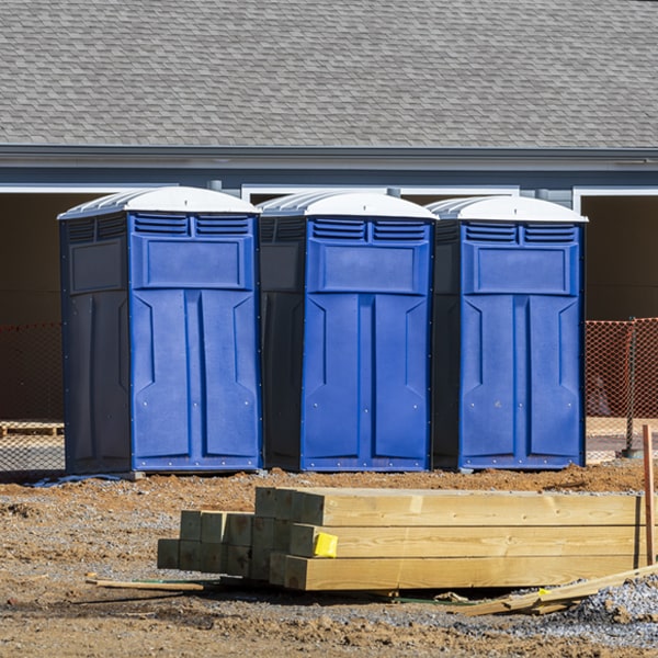 what is the cost difference between standard and deluxe portable toilet rentals in Hemlock Michigan